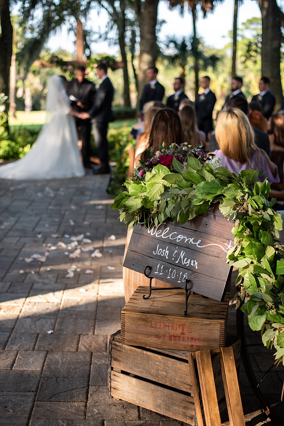 Rustic wedding welcome sign featuring vintage crates in various sizes