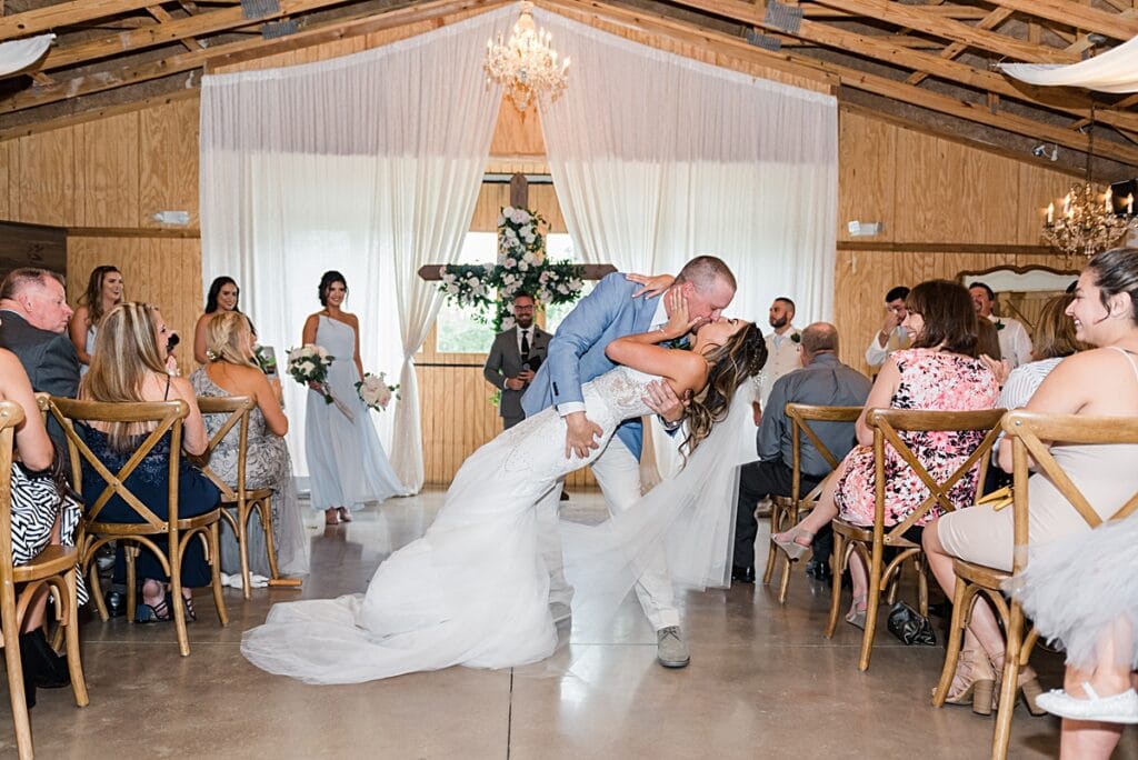Rustic rainy indoor ceremony in the up the creek farms' boathouse