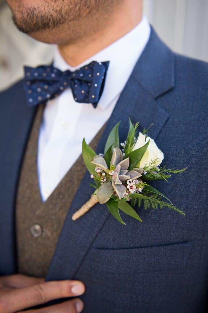 Groom style detail with succulent boutonniere