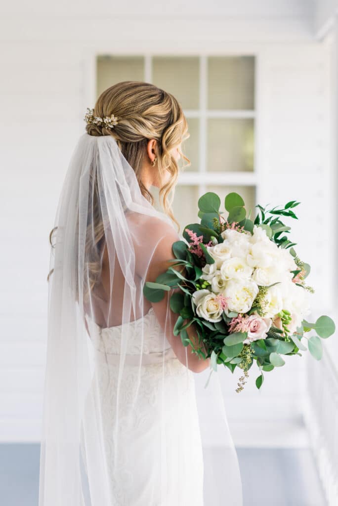 Bride first look with half up hair and veil 