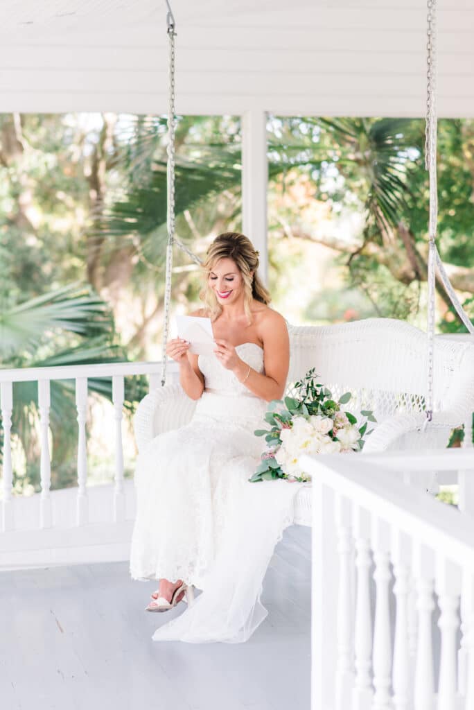 First look featuring a brevard county bride at Up The Creek Farms' Decklan house wraparound porch 
