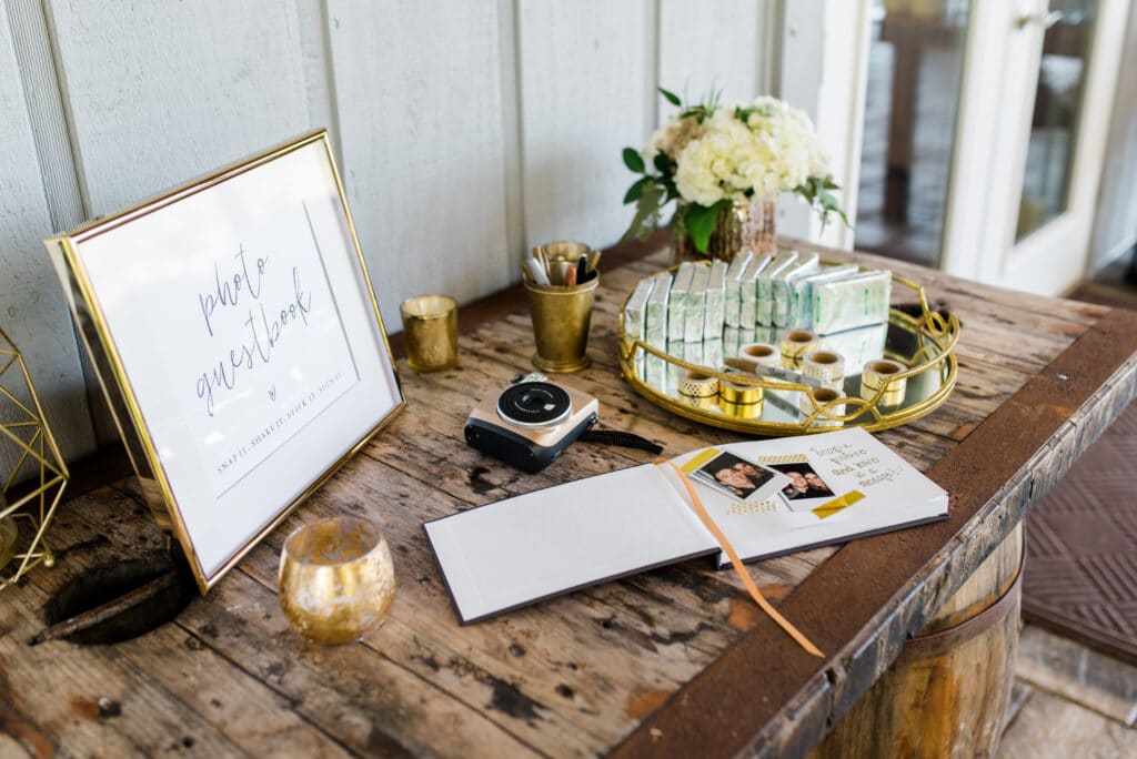 Guestbook display on rustic tabletop at Up The Creek Farms 
