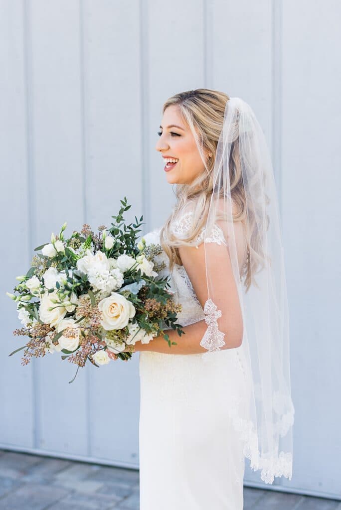 Violets in bloom bridal bouquet with white roses and textured florals 