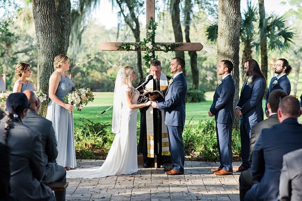 crystal and crates wooden cross used for outdoor ceremony at up the creek farms