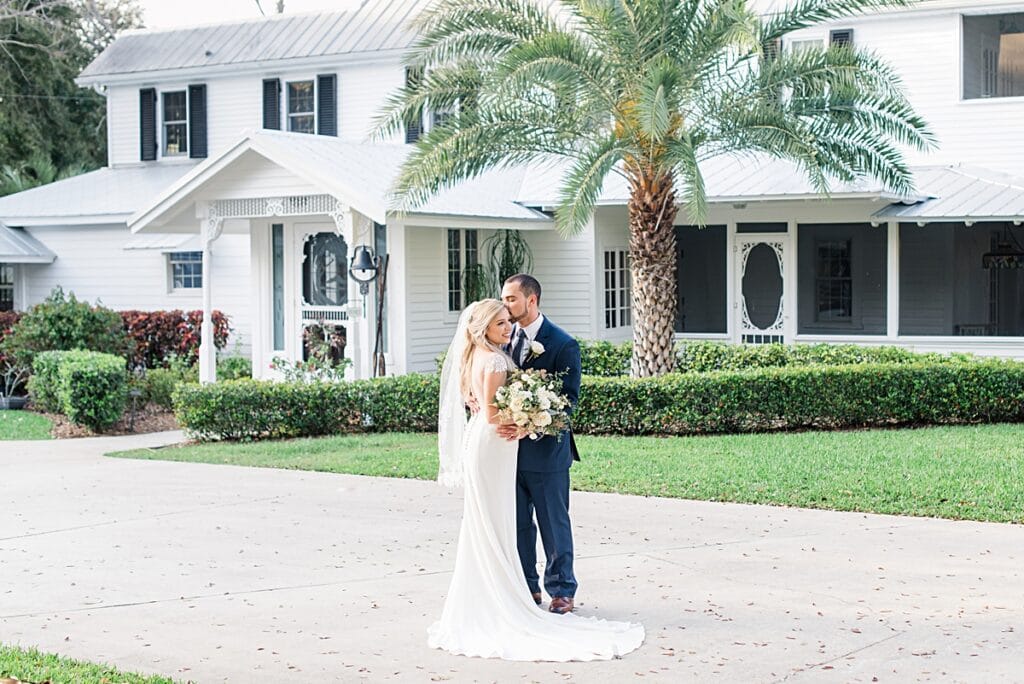 Brevard County first look for wedding couple outside the decklan house at up the creek farms 