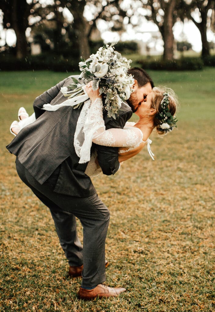 Rainy day wedding photography featuring whimsical bohemian couple