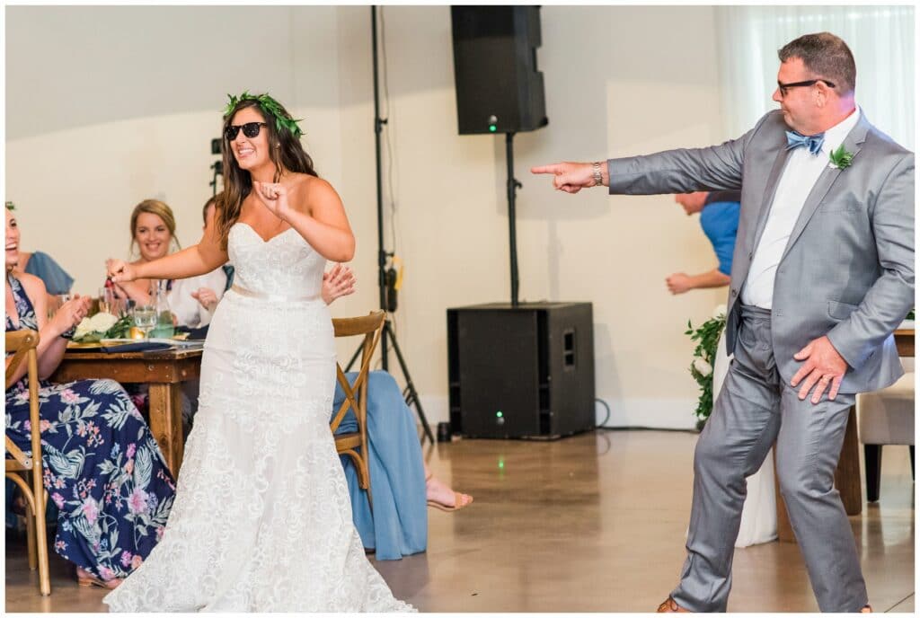 unique and fun father daughter wedding dance with bride wearing sunglasses and greenery crown