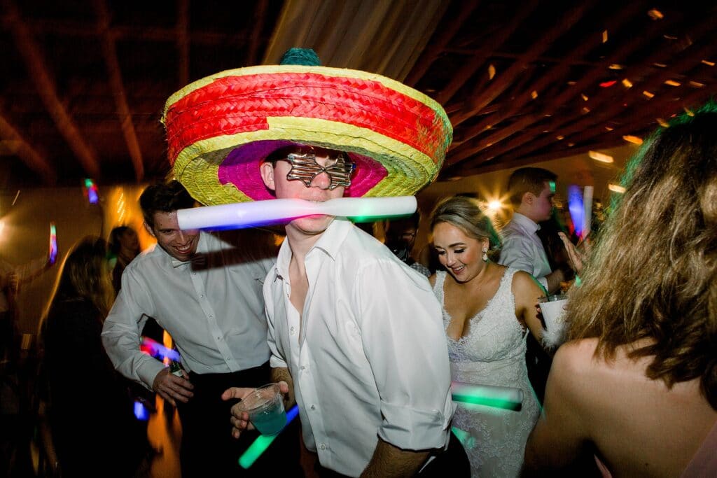 wedding reception at up the creek farms featuring sombreros 