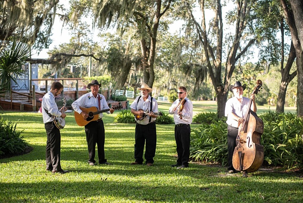 brevard county bluegrass band serenading guests at outdoor ceremony