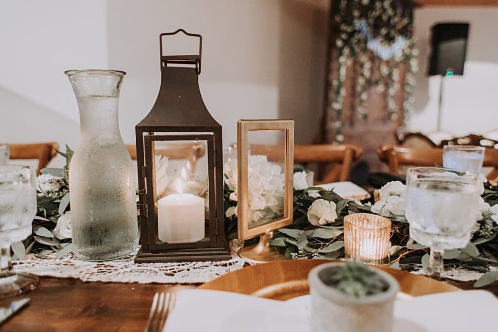 lanterns and greenery table runner centerpieces