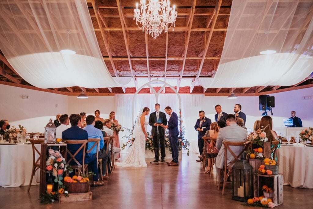 indoor ceremony at up the creek farms boathouse