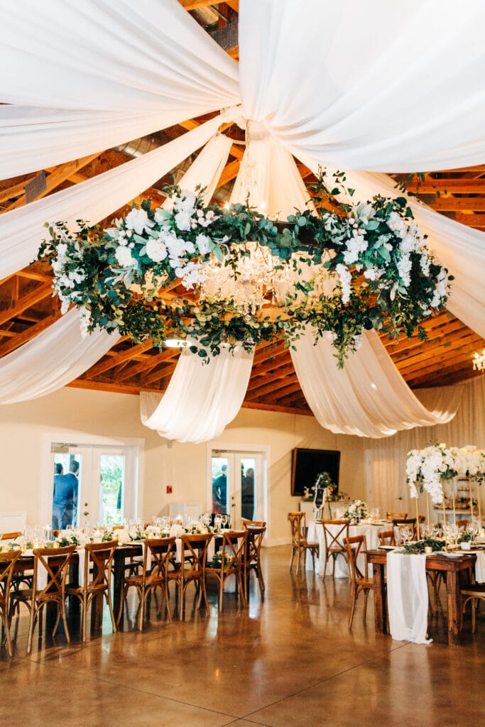 round hoop hanging floral installation for dance floor at up the creek farms