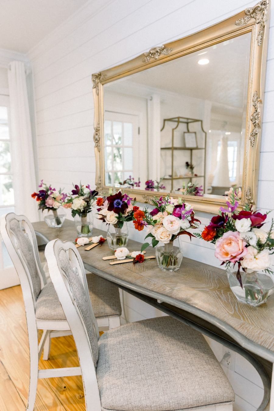 Bridal Suite prep area at historic wedding venue in Central FL set with wedding bouquets and antique mirror.