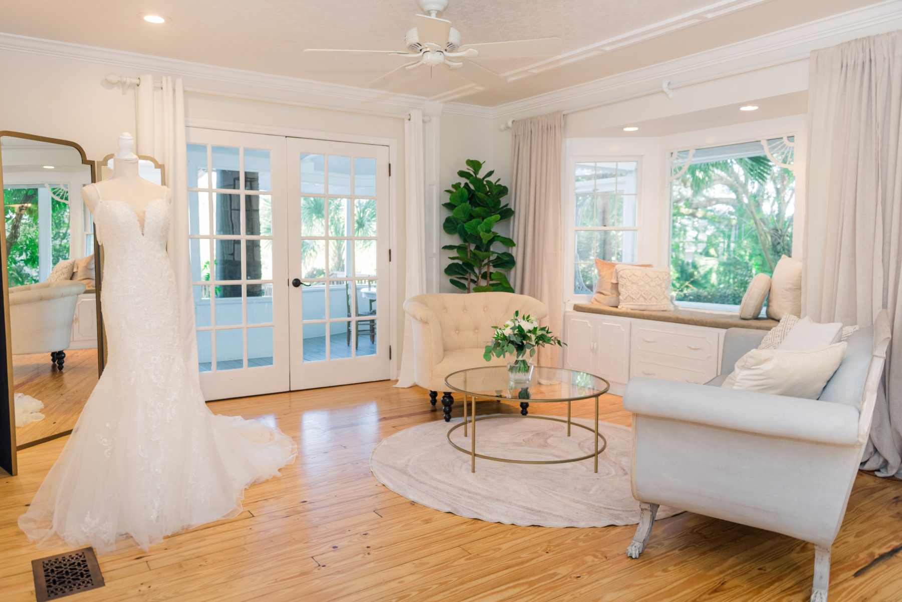 Bridal Suite with wedding dress displayed at Historic farmhouse wedding venue in Florida.