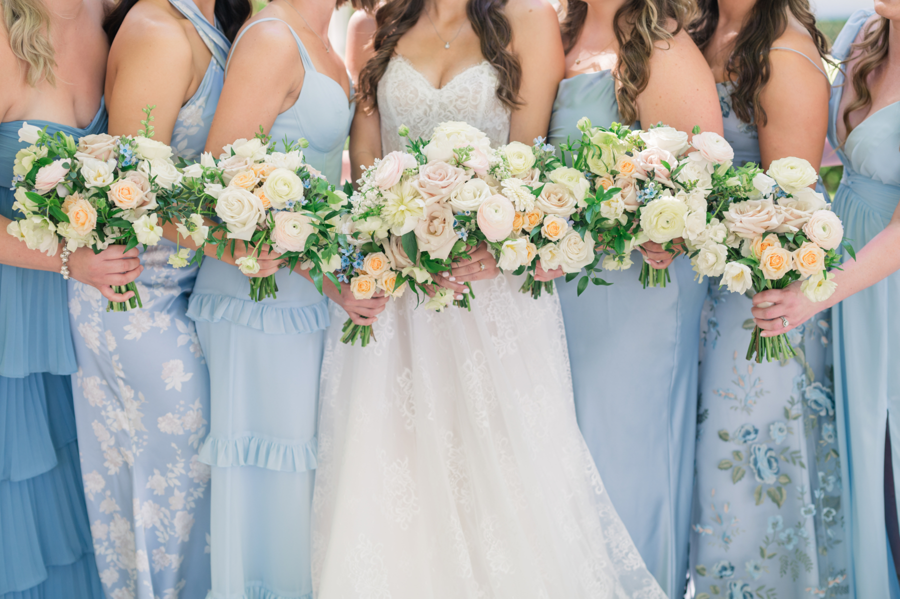 Cocoa beach wedding party posing with bouquets